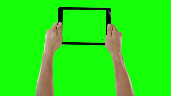 Hands holding digital tablet alt