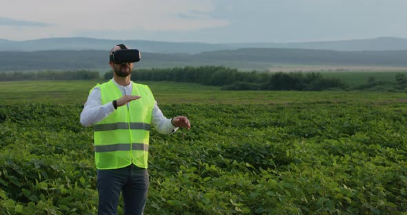 Farm Specialist Engineer Using Technology VR Monitoring Harvest Working for Agriculture Productivity alt