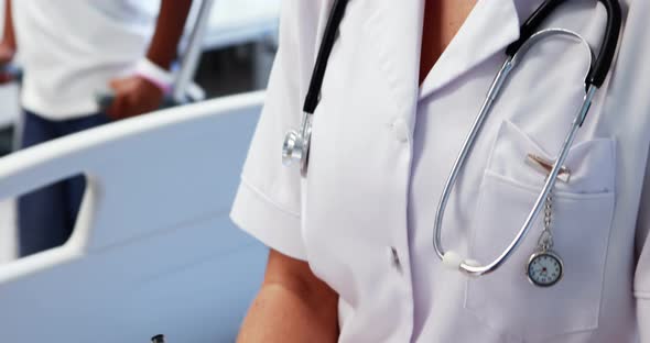 Female doctor writing a report alt