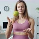 Slow Motion Portrait of Playful Young Lady Throwing and Catching Apple and Smiling at Home - VideoHive Item for Sale