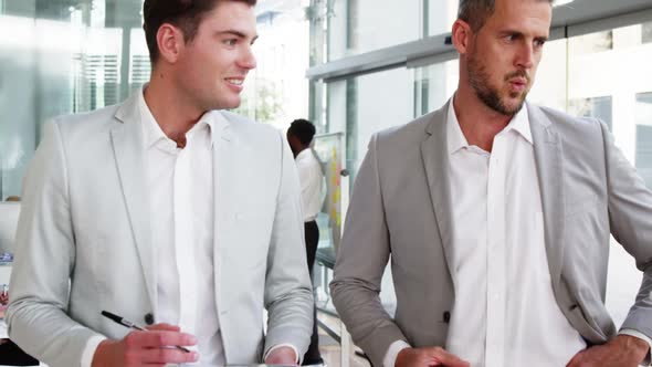 Business people interacting with each other alt