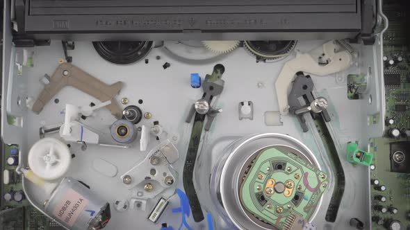 Closeup Shot Showing Inside of a Vcr While It Ejects a Vhs Cassette alt