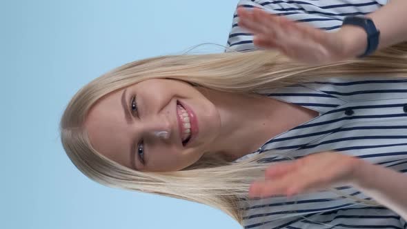Portrait of Smiling Young Lady Giving Applause To Somebody.