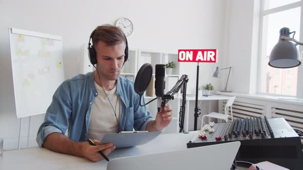 Man Beginning Radio Broadcast alt