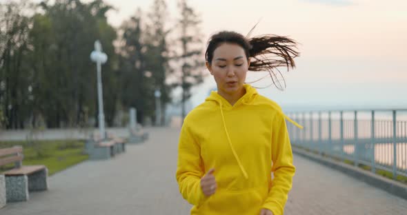 Young Woman Running In The Park alt