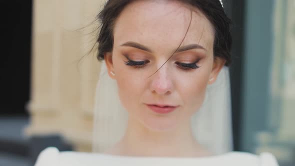 Close Up Portrait of a Caucasian Beautiful Bride with Blue Eyes and Thin Lips Shooted on Tilt Shift
