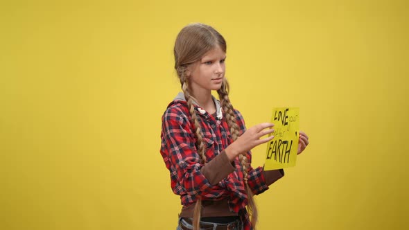 Confident Teenage Girl Turning Looking Around Showing Love your Mother Earth Message alt