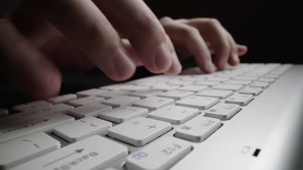 Close-up time lapse typing on keyboard with fingers. Macro soft focus dolly shot alt