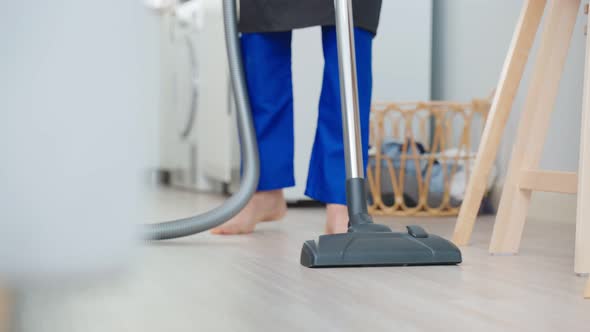 Asian cleaning service woman worker cleaning in living room at home. alt