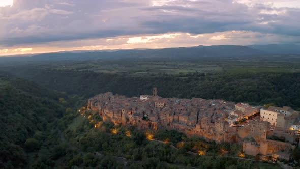 PITIGLIANO, ITALY. Aerial view in Sunset of beautiful town in Tuscany 4K alt