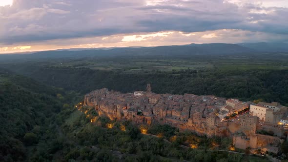 PITIGLIANO, ITALY. Aerial view in Sunset of beautiful town in Tuscany 4K