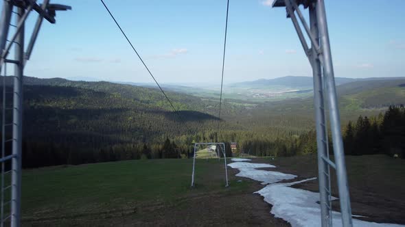 Flying Between the Cable Cars on the Slopes in the Spring