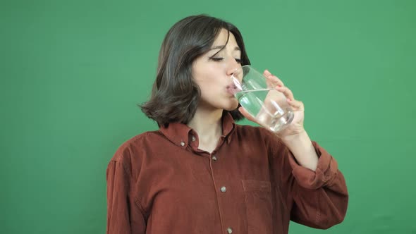 Woman Drinking Water From Glass alt