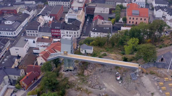 Top View Of The Footbridge Connecting The Glass Lift To The Floyheia Park In Arendal, Norway. aerial alt