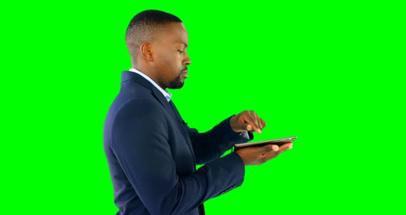 Businessman holding digital tablet alt