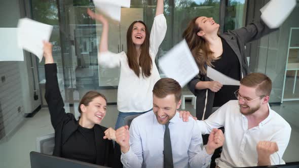 Group of Business Professionals Celebrate Successful Product Release alt