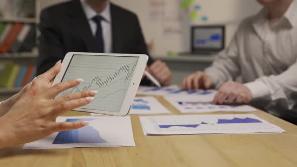 Female Hands Use Digital Tablet to View Information Analyze and Check Graphs and Charts alt