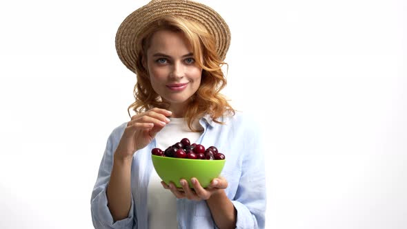 Sexy Pretty Lady in Straw Summer Hat Eating Sweet Cherry Berry Sensually Seasonal Fruit alt
