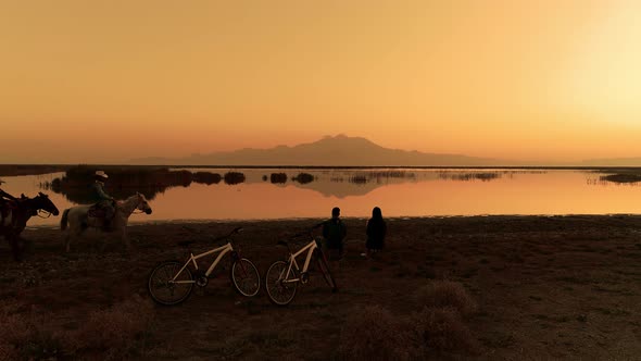 People Reading a Book and Horsemen in Nature alt