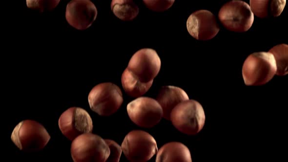 Super Slow Motion a Bunch of Hazelnuts Falls Down alt