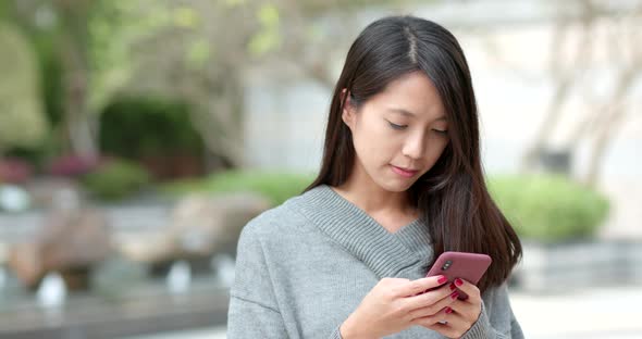 Woman use of mobile phone alt