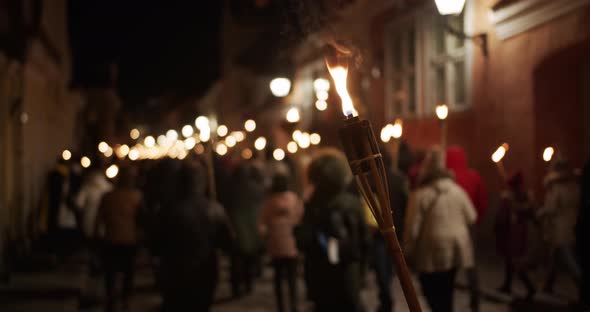 Torchlight Procession at Night People Protest with Burning Torches alt
