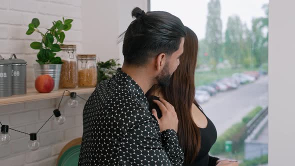 Passionate Affectionate Interracial Young Couple Hugging and Looking at Each Other with Love alt