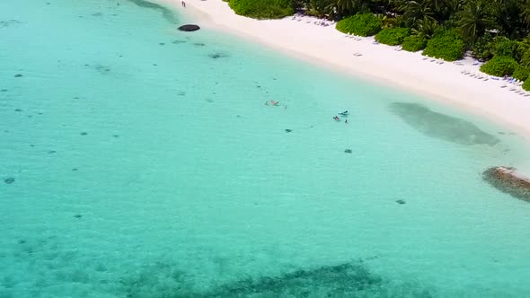 Aerial drone scenery of resort beach by ocean with sand background alt