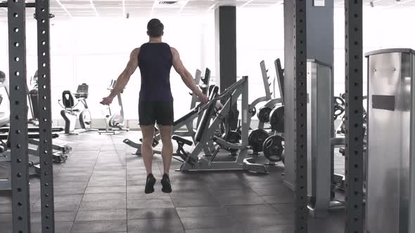 Athletic Muscular Male Jumping With Skipping Rope, Training Before Competition alt