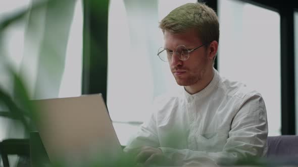 Office Worker is Sending Emails and Making Report in Laptop Portrait in Office of Large Successful alt
