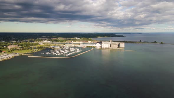 Aerial view of boat marina and port grain terminal on the coast of the lake Erie. Aerial view of por alt