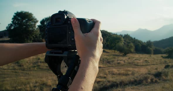 Woman Hands Closeup Adjust Photographic Equipment on Tripod at Mountain Travel alt