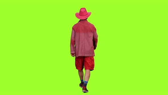 Rear View of Man Tourist Walks in Red Сlothing