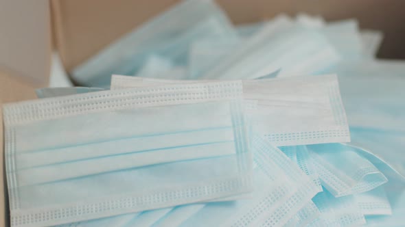Blanks for Medical Surgical Masks Fall From Machine Into Box