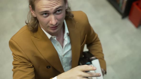 Girl with her boyfriend in library Bionics Cybernetic Robotic-arm Hand prosthesis alt