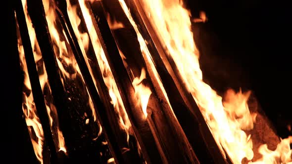 Big Bonfire Burns at Night in Slow Motion on a Black Background on Nature alt