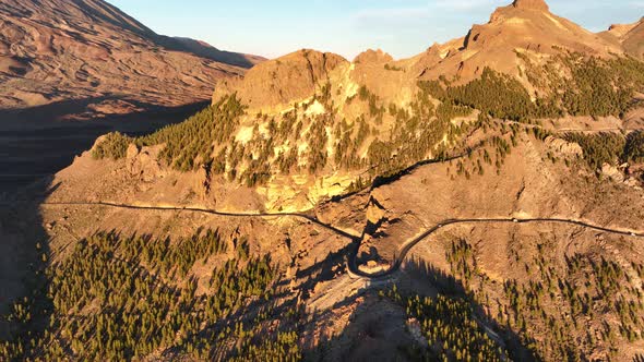 Aerial Panoramic Dramatic View of a Wilderness Mountain Peak and a Road Forest Rocky Volcanic alt