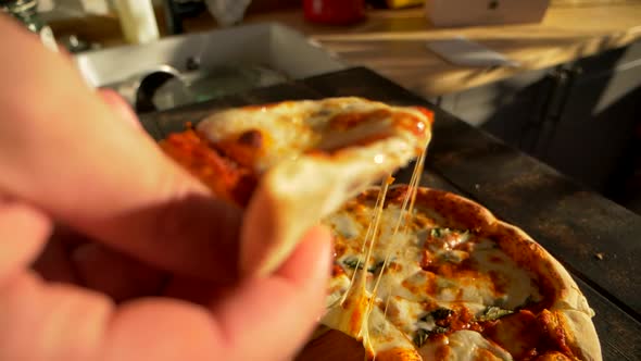 Chef Cook Take Slice of Baked Pizza with Cheese Stretch Places It on Plate