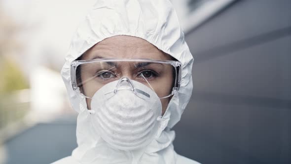 Portrait of a worker in protective suit. Shot with RED helium camera in 8K. alt