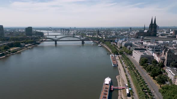 Cologne, North Rhine-Westphalia, Germany - Panorama aerial bird drone flight towards the Köln Dom an alt