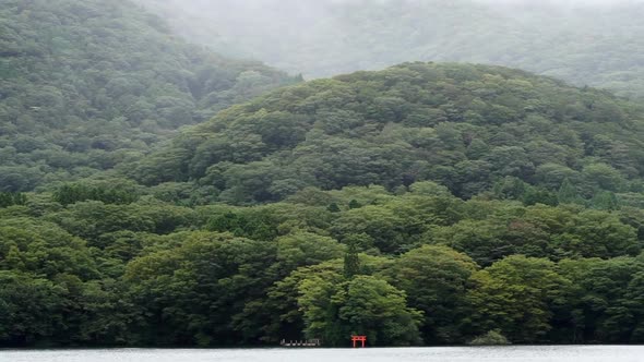 Lake Ashi Red Torii Gate View From Pirate Boat Cruise To Hakone Japan In Cloudy Rainy Day