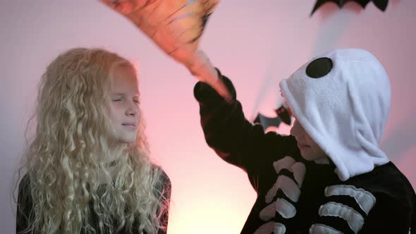 Halloween Kids Portrait Brother and Sister in Halloween Costume at Home alt