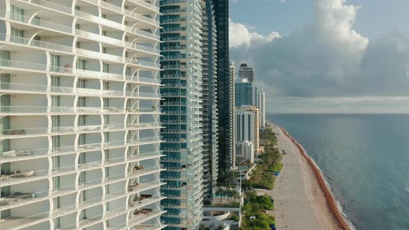 Close Up Aerial View on the Modern Residential Apartment Buildings at the Ocean alt