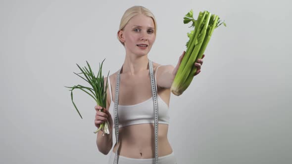 Young Woman with Vegetables Isolated on White Background alt