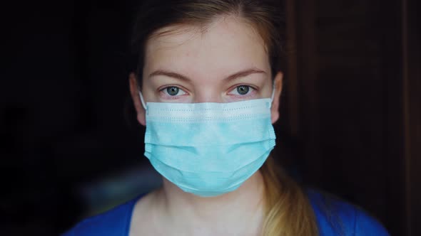 Medical Worker Portrait. Confident Female Doctor in Protective Face Mask and Eyeglasses. alt