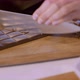 Crush And Cut Chocolate On The Wooden Board - VideoHive Item for Sale