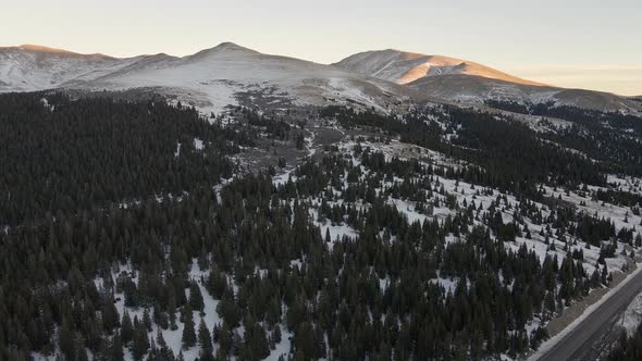 Aerial footage flying over traffic on Highway 9 towards Mt. Silverheels at sunset. Filmed in the Roc alt