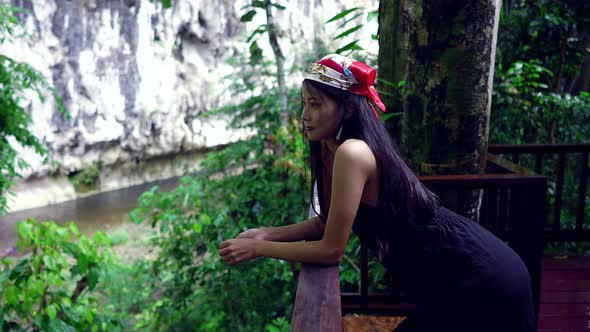 Cute Asian Girl Chilling in Front of a Treehouse in Slow Motion Thailand alt
