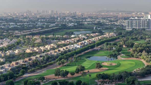 Aerial View to Villas and Houses with Golf Course with Green Lawn and Lakes Timelapse alt