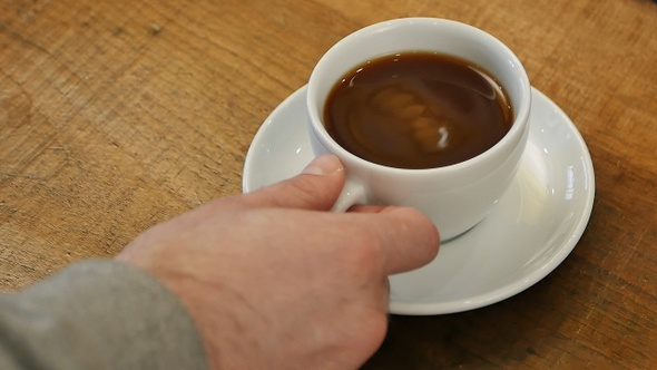 Male Hand Take a Cup of Coffee